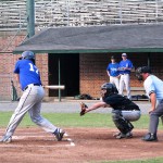 Coach Dan Scully of the CS&D Twins looks in at his batter